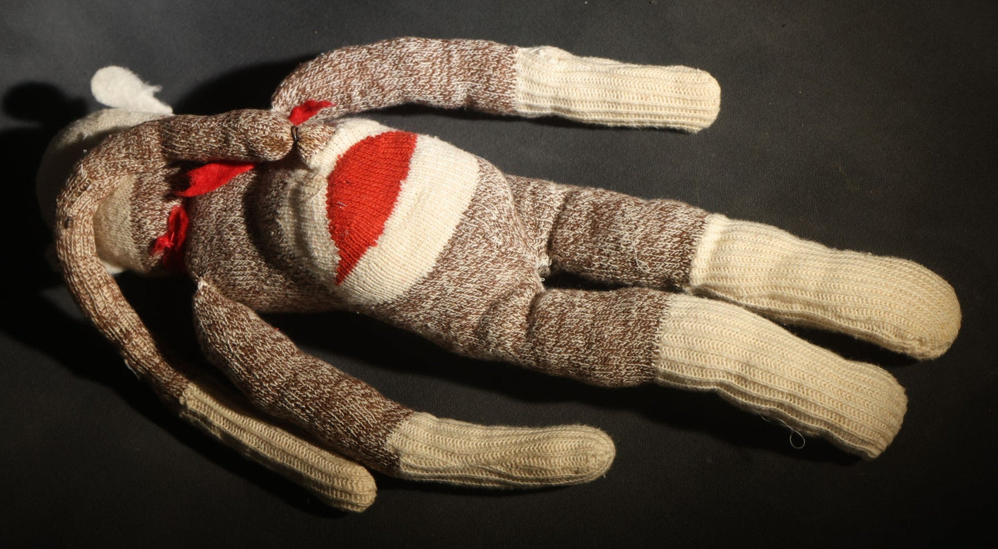 Vintage Sock Monkey Stuffed Toy with Embroidered Features and Red Mouth
