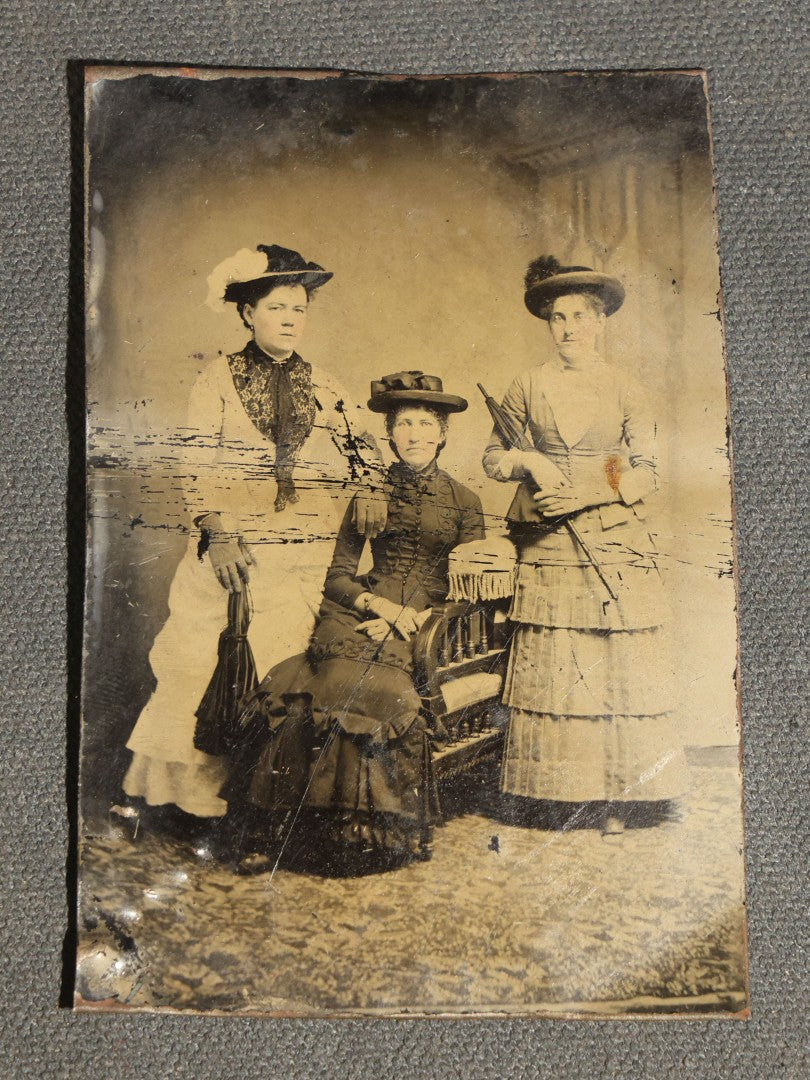 Grouping of Six Antique Tintype Photographs, Portrait of Women, Pairs, and a Young Man, Including One Gem Tintype in Paper Frame