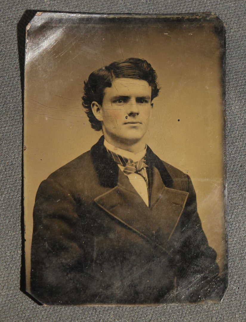 Grouping of Six Antique Tintype Photographs, Portrait of Women, Pairs, and a Young Man, Including One Gem Tintype in Paper Frame