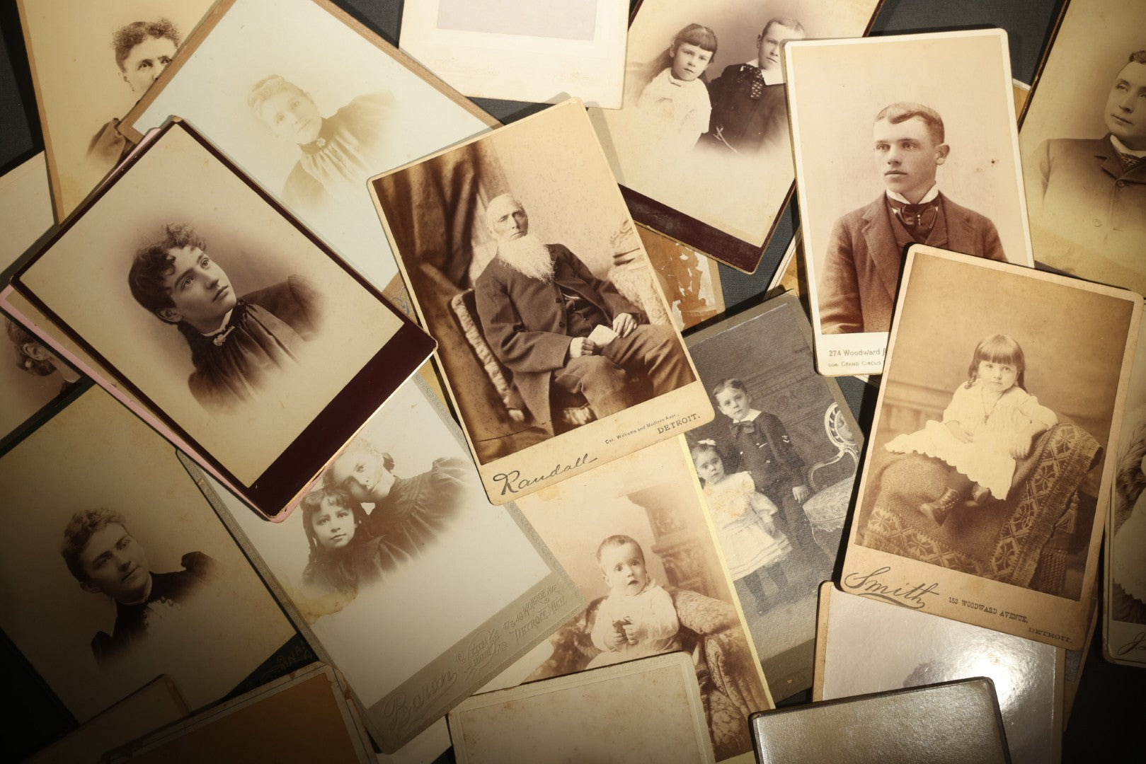 Grouping of 29 Antique Cabinet Card Photographs, Portrait Studies of Men, Women, and Children, Including Examples by Randall and Smith of Detroit, and Other Michigan Studios