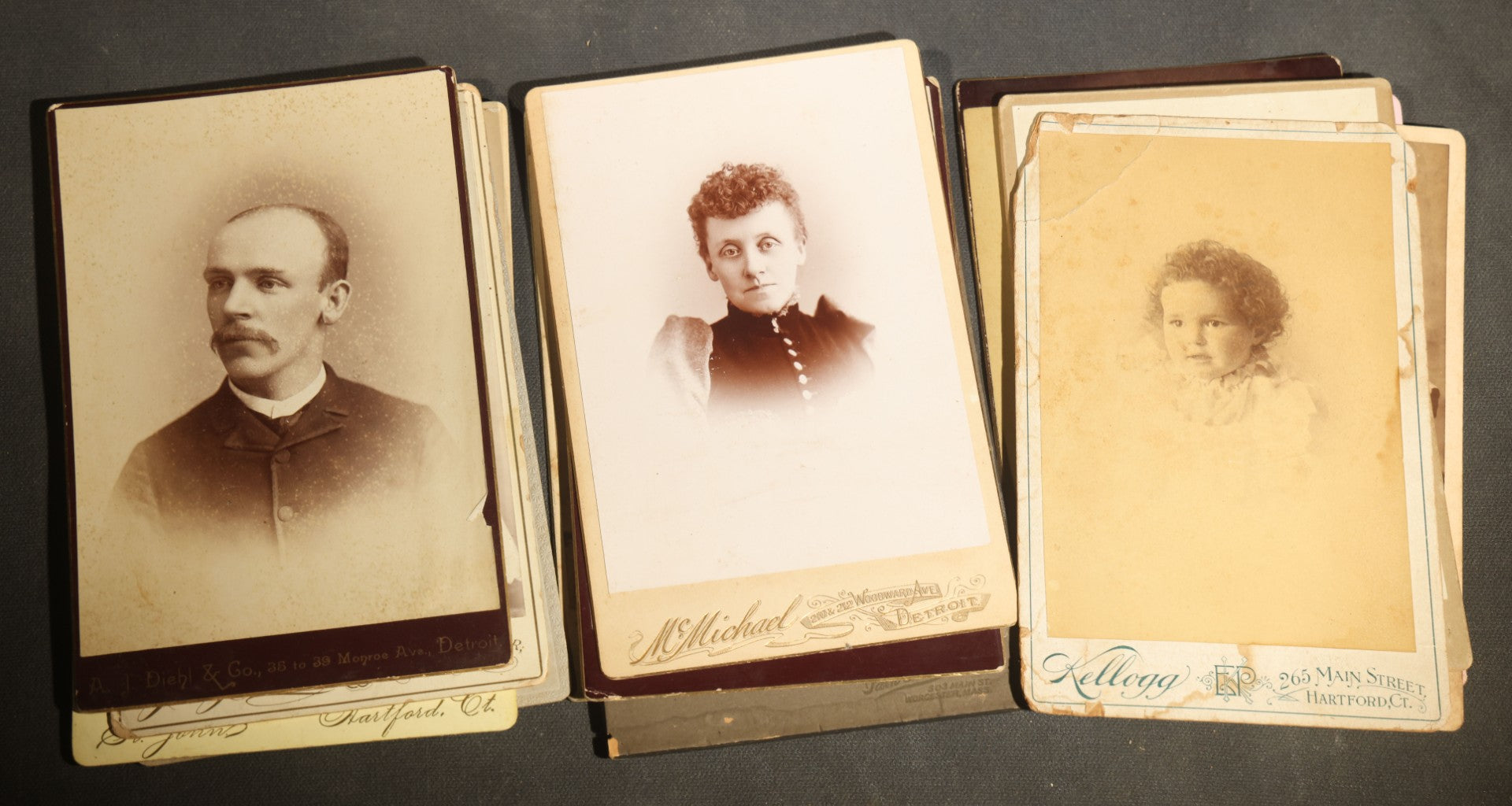 Grouping of 29 Antique Cabinet Card Photographs, Portrait Studies of Men, Women, and Children, Including Examples by Randall and Smith of Detroit, and Other Michigan Studios