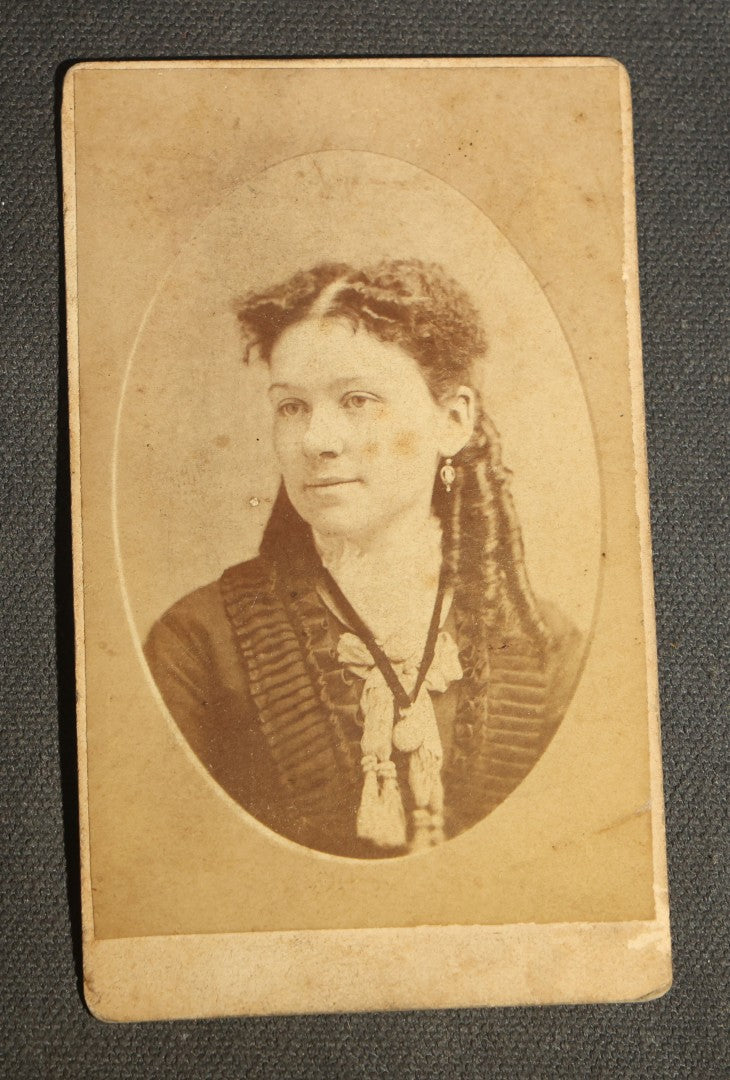 Grouping of 10 Antique Carte De Visite C.D.V. Photographs, Portrait Studies of Men, Women, and Children, Including Two Illustrated Filler Cards
