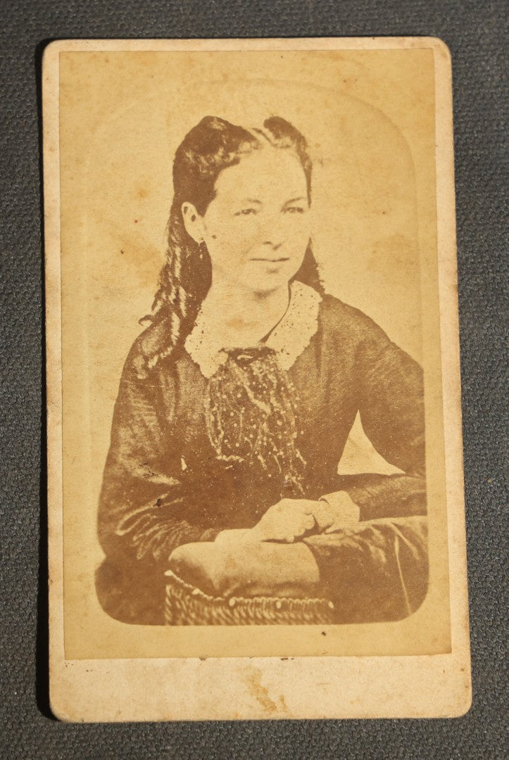 Grouping of 10 Antique Carte De Visite C.D.V. Photographs, Portrait Studies of Men, Women, and Children, Including Two Illustrated Filler Cards