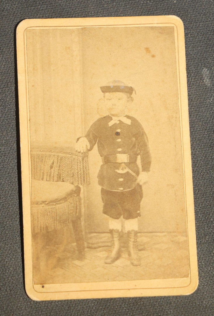 Grouping of 10 Antique Carte De Visite C.D.V. Photographs, Portrait Studies of Men, Women, and Children, Including Two Illustrated Filler Cards
