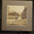 Lot 101 - Antique Board-Mounted Photograph of a Young Man Astride an Early Indian Motorcycle on a Rural Road, 5-1/4" W x 5-1/4" H