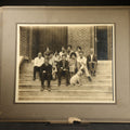 Lot 103 - Antique Board-Mounted Photograph of a High School Class Group on Building Steps with Bulldog Mascot, 14" W x 12" H