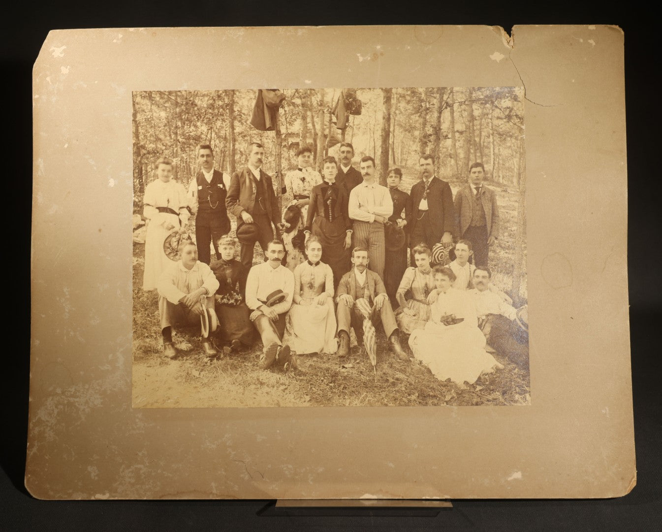 Antique Board-Mounted Photograph of a Large Group Gathered Outdoors in a Wooded Setting, Men and Women in Victorian Dress