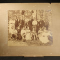 Lot 104 - Antique Board-Mounted Photograph of a Large Group Gathered Outdoors in a Wooded Setting, Men and Women in Victorian Dress, 14" W x 11" H
