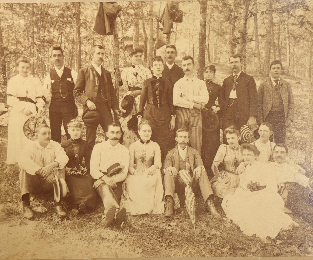 Antique Board-Mounted Photograph of a Large Group Gathered Outdoors in a Wooded Setting, Men and Women in Victorian Dress