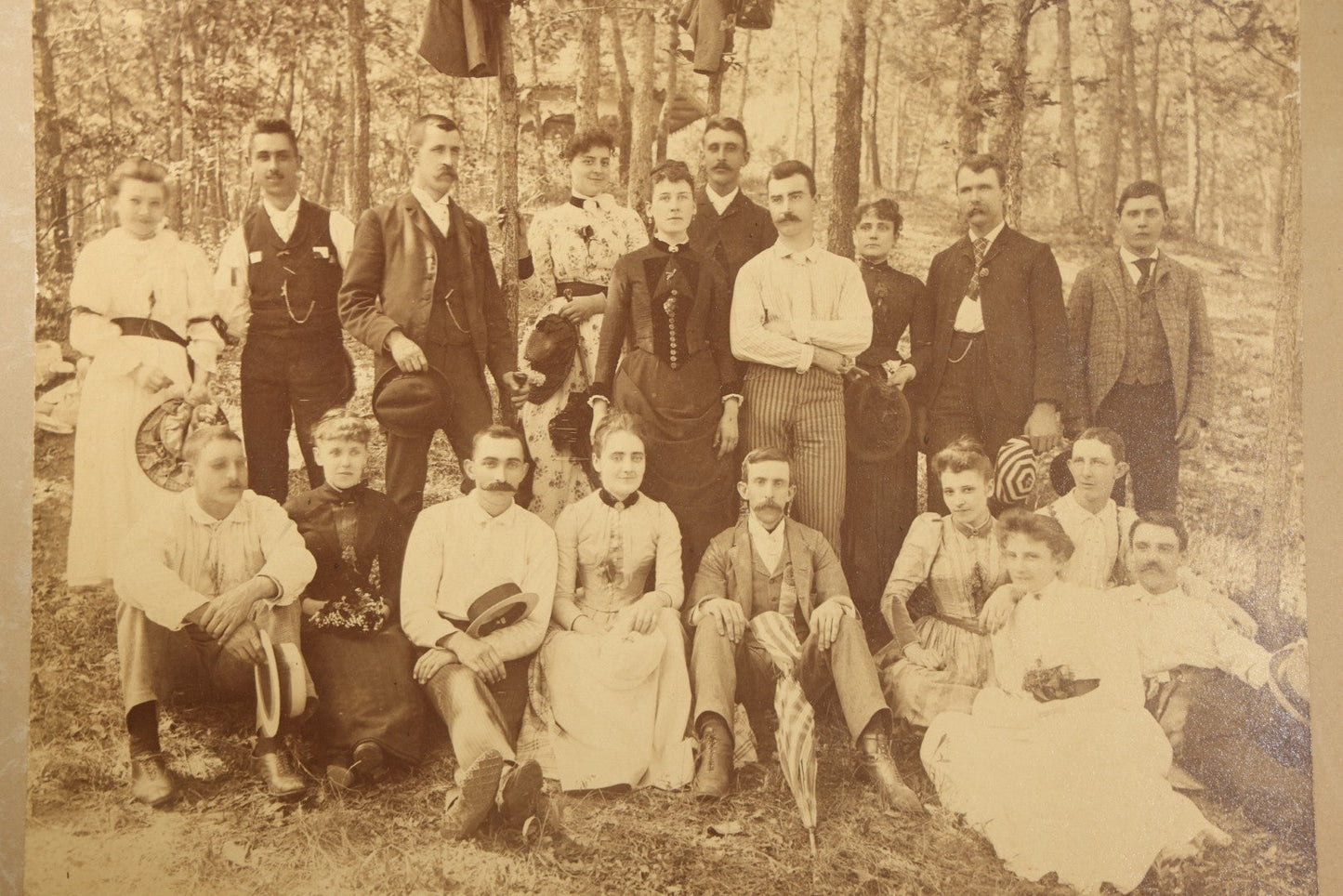 Antique Board-Mounted Photograph of a Large Group Gathered Outdoors in a Wooded Setting, Men and Women in Victorian Dress