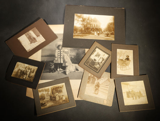 Grouping of Nine Antique Photographs, Domestic and Outdoor Scenes Including Horse-Drawn Sleigh, Children with Dogs, Women at Home, and Horse in Snow