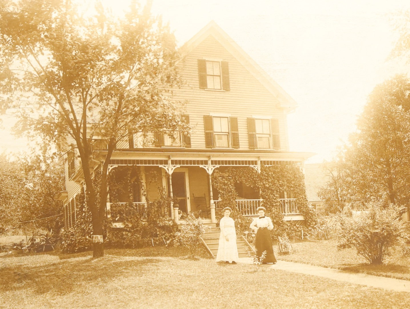 Grouping of Nine Antique Photographs, Domestic and Outdoor Scenes Including Horse-Drawn Sleigh, Children with Dogs, Women at Home, and Horse in Snow