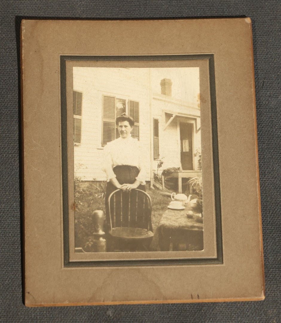 Grouping of Nine Antique Photographs, Domestic and Outdoor Scenes Including Horse-Drawn Sleigh, Children with Dogs, Women at Home, and Horse in Snow