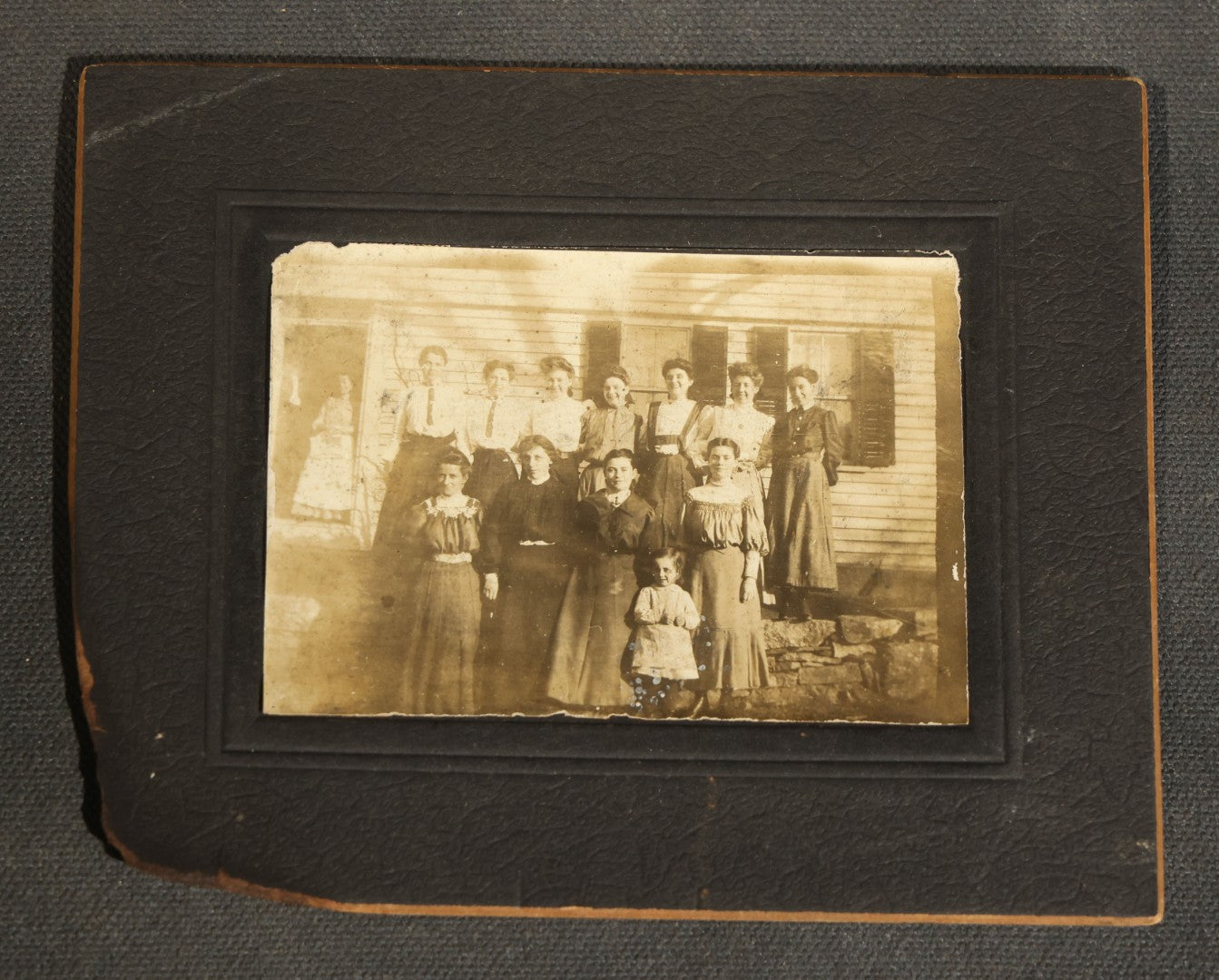 Grouping of Nine Antique Photographs, Domestic and Outdoor Scenes Including Horse-Drawn Sleigh, Children with Dogs, Women at Home, and Horse in Snow