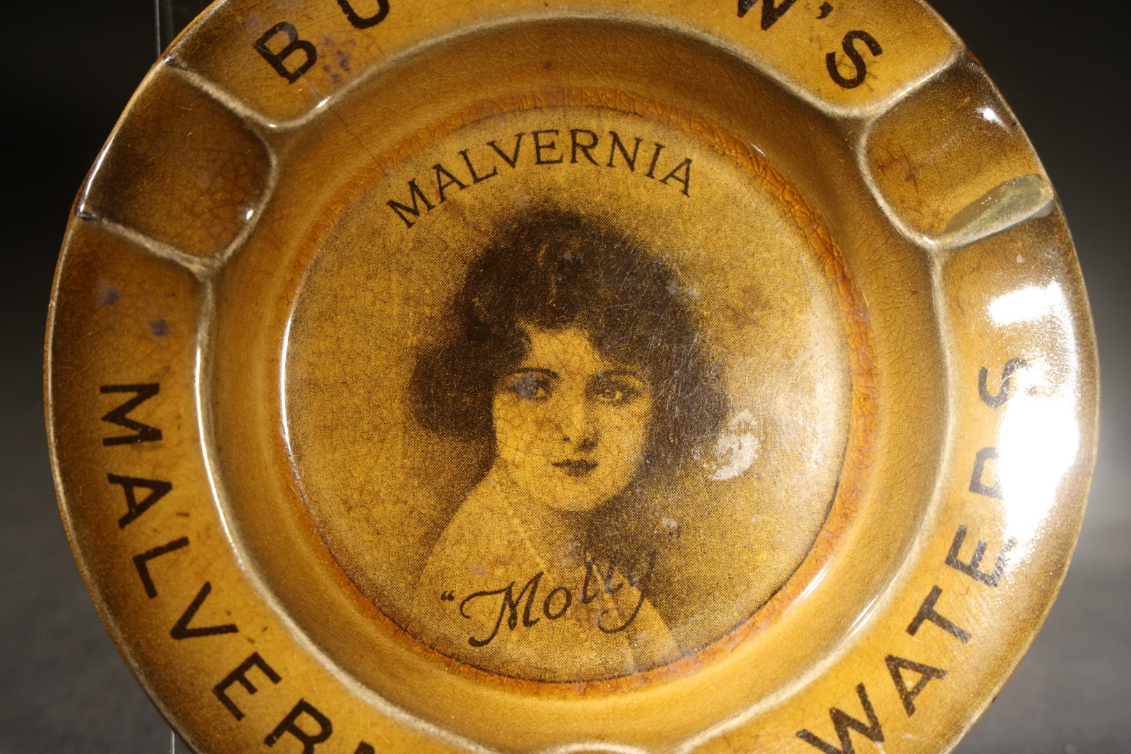 Antique Burrow's Malvern Waters "Malvernia" Advertising Ceramic Ashtray with Portrait of "Molly," The Associated Potteries Co., Hancock & Corfield Ltd., Mitcham London