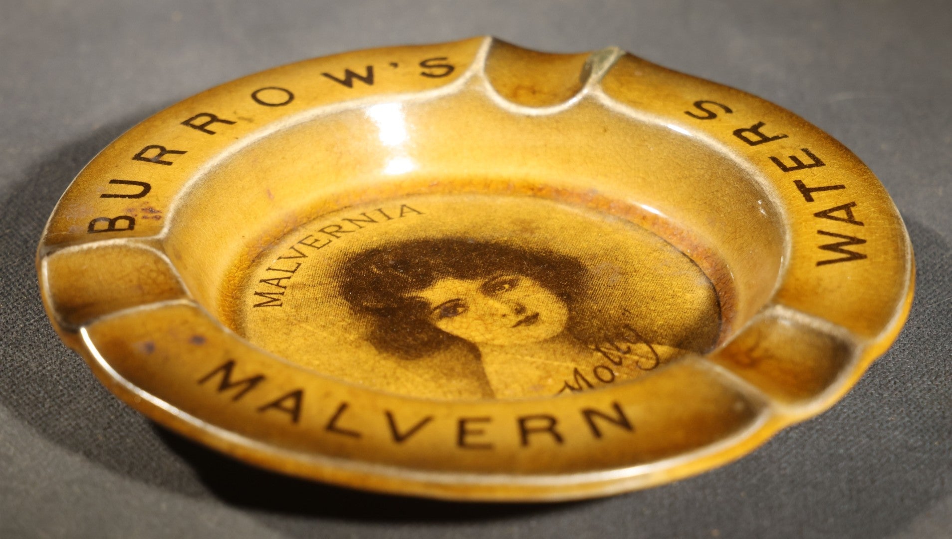Antique Burrow's Malvern Waters "Malvernia" Advertising Ceramic Ashtray with Portrait of "Molly," The Associated Potteries Co., Hancock & Corfield Ltd., Mitcham London