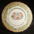 Lot 077 - Antique Porcelain 1910 Calendar Plate with Cherubs, New Year Bell, and Hourglass Motif, Note Chip to Lower Center Rim, 8-3/8" W