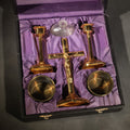 Lot 020 - Vintage Portable Catholic Travel Mass Kit with Gilt Crucifix, Candlesticks, Bowls, and Glass Holy Water Bottle in Black Case with Purple Silk Lining, 9-3/4" L x 10-3/4" W