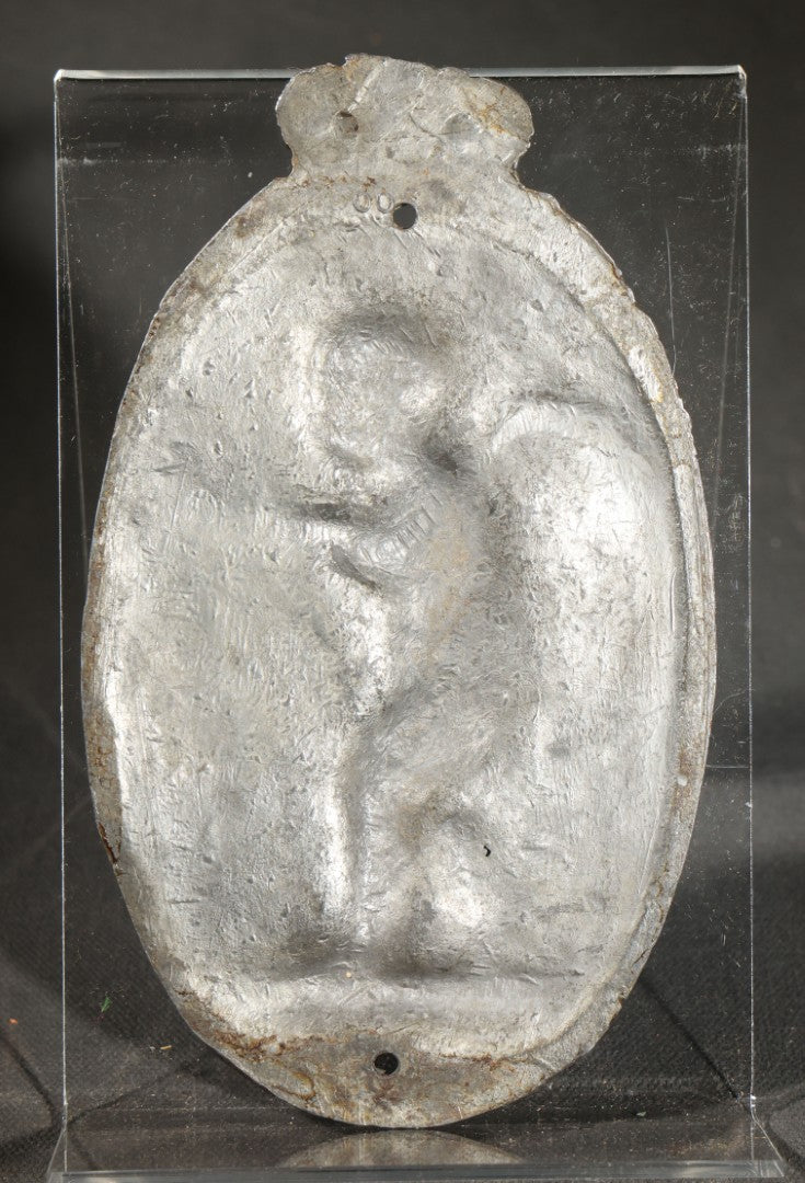 Antique Cast Iron Oval Wall Plaque of Cupid with Bow and Arrow, Shell and Crown Crest, Note Loss to Top of Bow
