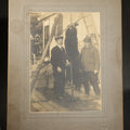 Lot 040 - Antique Board-Mounted Photograph of Two Hunters Posing with a Hanging Black Bear, 8" W x 10" H