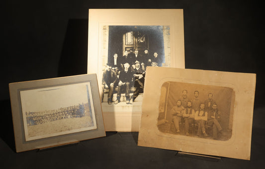 Trio of Antique Board-Mounted Photographs of Group Portraits, Including Seven Men Photographed by Geo. E. Mitchell's Gallery of Art, Lowell, Massachusetts, a Large Military or Militia Group with Rifles, and Ten Men on Building Steps