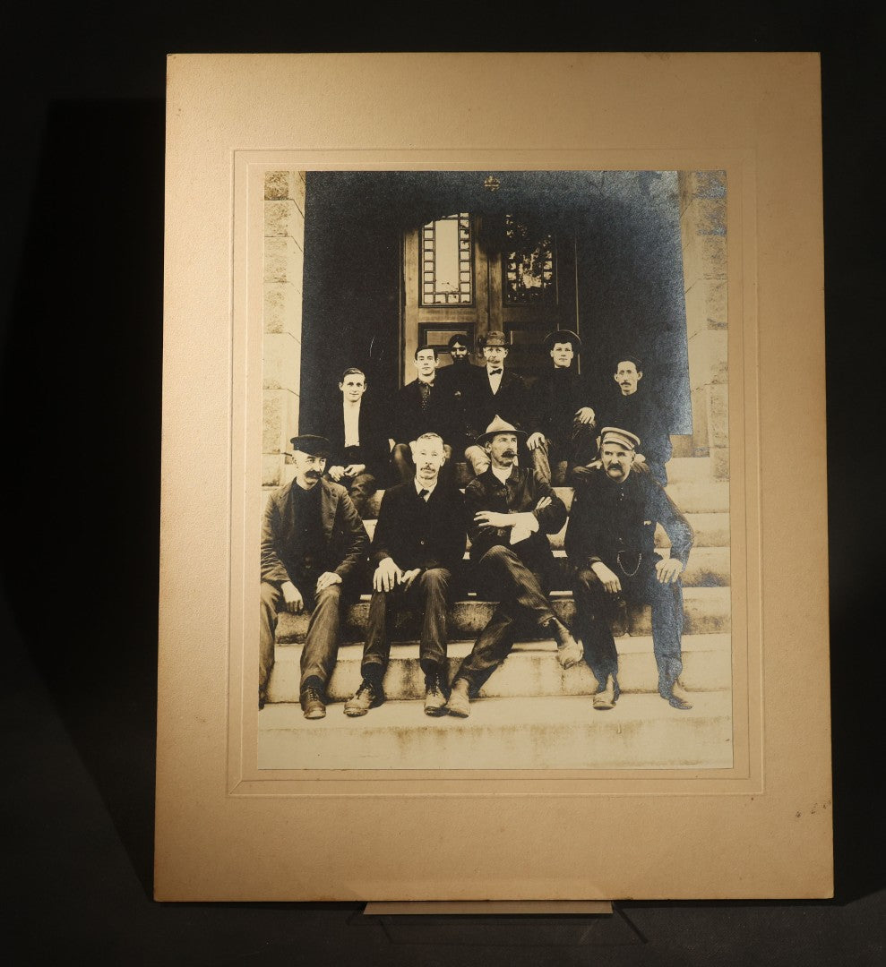 Trio of Antique Board-Mounted Photographs of Group Portraits, Including Seven Men Photographed by Geo. E. Mitchell's Gallery of Art, Lowell, Massachusetts, a Large Military or Militia Group with Rifles, and Ten Men on Building Steps