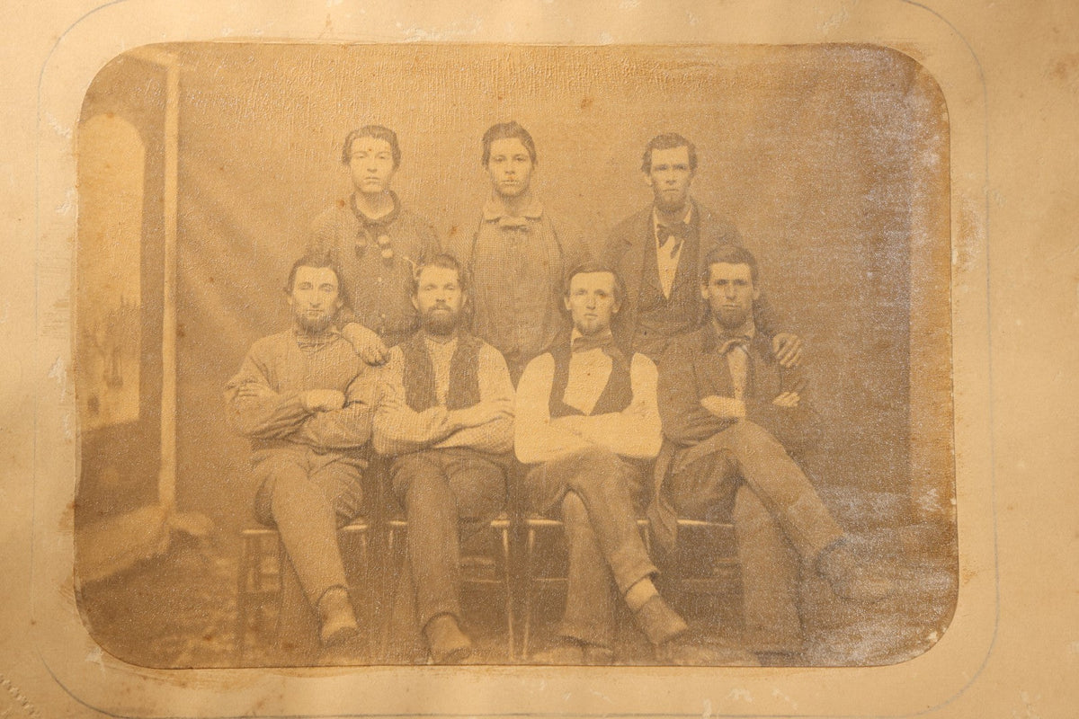 Trio of Antique Board-Mounted Photographs of Group Portraits, Including Seven Men Photographed by Geo. E. Mitchell's Gallery of Art, Lowell, Massachusetts, a Large Military or Militia Group with Rifles, and Ten Men on Building Steps