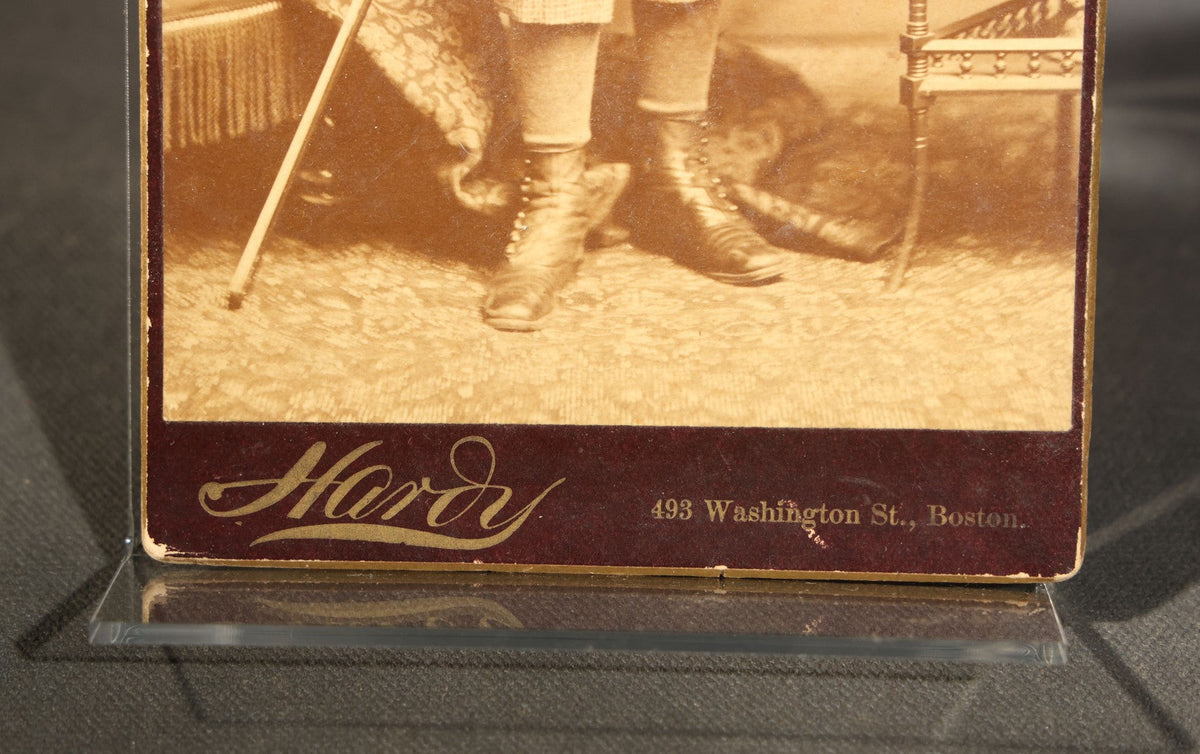 Trio of Antique Board-Mounted Photographs Including a Cabinet Card of a Boy with Violin, by Hardy, Boston, a Horse-Drawn Carriage Party by J. P. Haseltine, Lancaster, New Hampshire, and a Man Posed with Cannons, by Hollis Studio, Boston