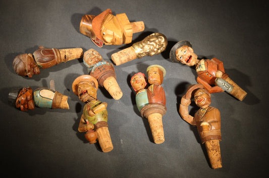 Grouping of Nine Vintage Carved and Painted Wood Figural Bottle Stoppers Including Animated Examples