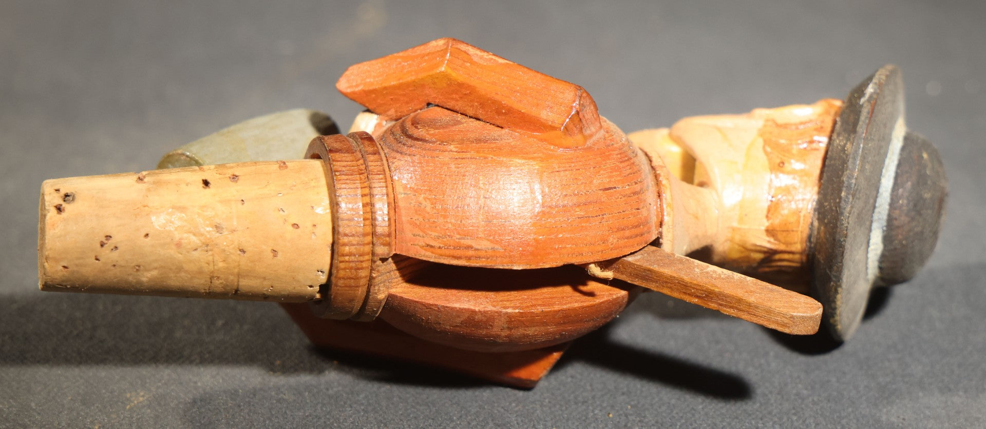 Grouping of Nine Vintage Carved and Painted Wood Figural Bottle Stoppers Including Animated Examples
