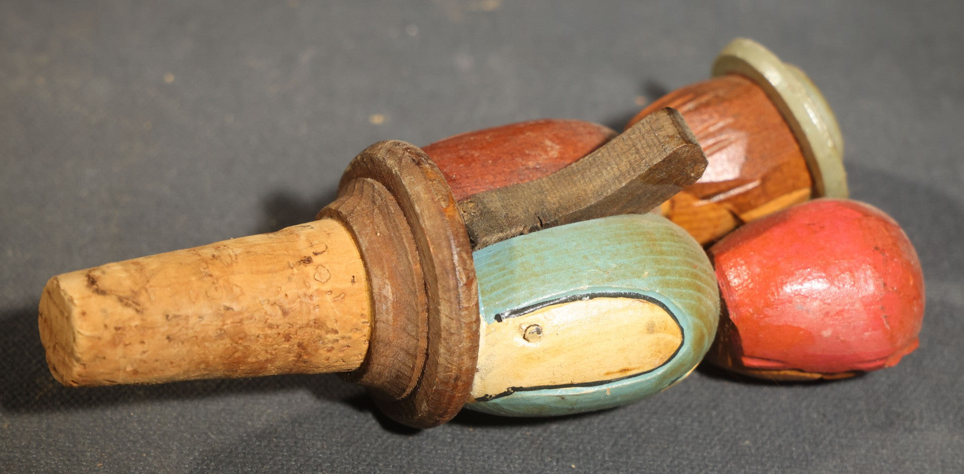 Grouping of Nine Vintage Carved and Painted Wood Figural Bottle Stoppers Including Animated Examples