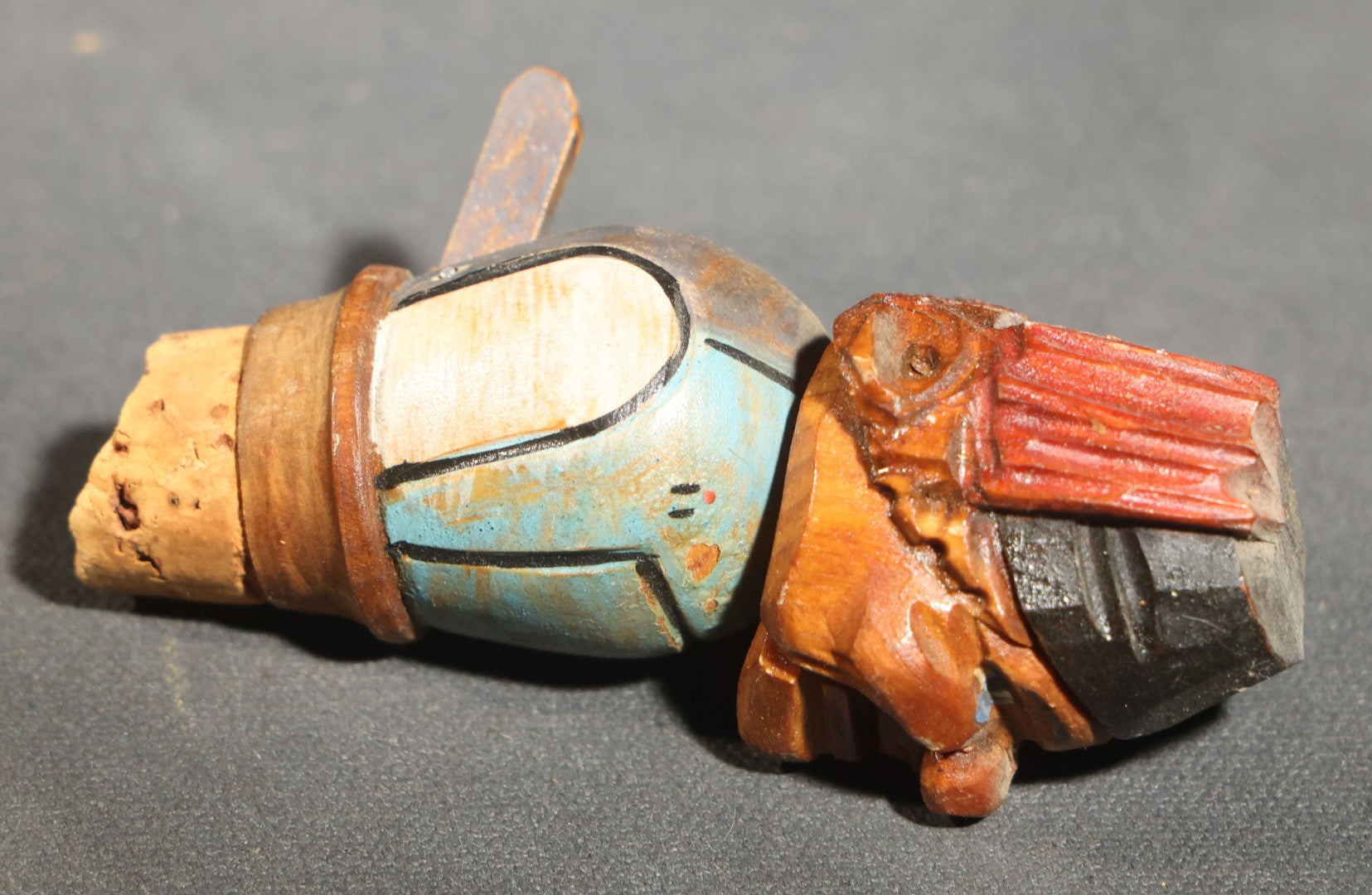 Grouping of Nine Vintage Carved and Painted Wood Figural Bottle Stoppers Including Animated Examples