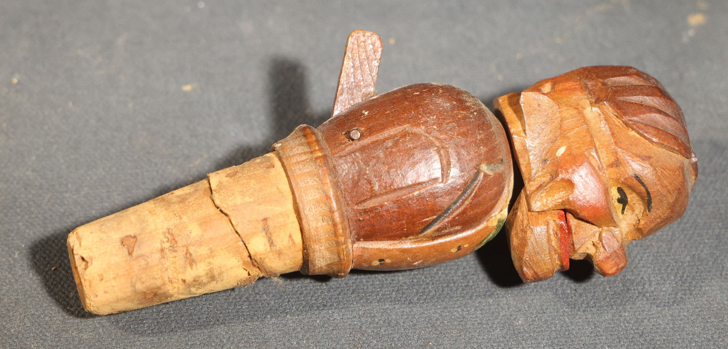 Grouping of Nine Vintage Carved and Painted Wood Figural Bottle Stoppers Including Animated Examples