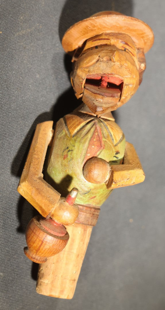 Grouping of Nine Vintage Carved and Painted Wood Figural Bottle Stoppers Including Animated Examples