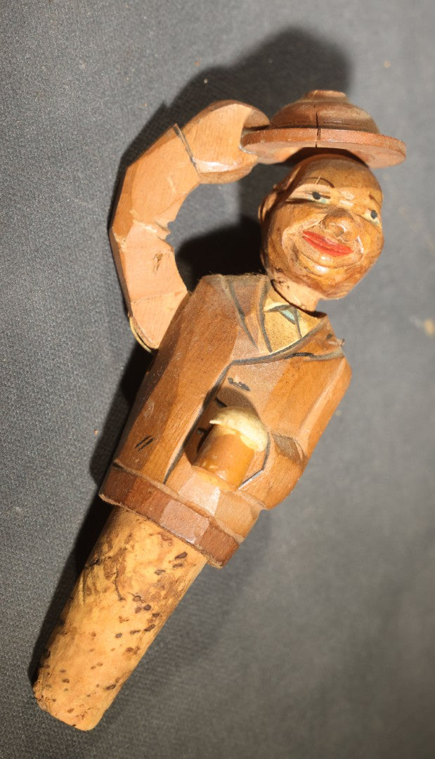 Grouping of Nine Vintage Carved and Painted Wood Figural Bottle Stoppers Including Animated Examples