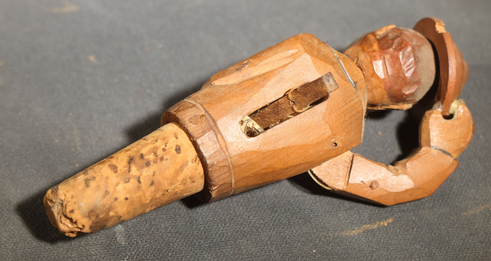 Grouping of Nine Vintage Carved and Painted Wood Figural Bottle Stoppers Including Animated Examples