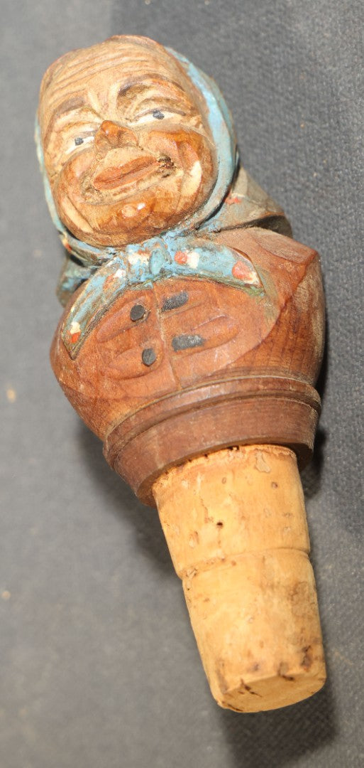 Grouping of Nine Vintage Carved and Painted Wood Figural Bottle Stoppers Including Animated Examples