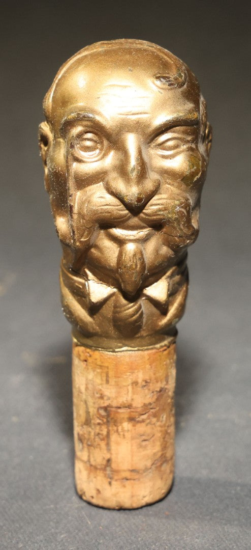Grouping of Nine Vintage Carved and Painted Wood Figural Bottle Stoppers Including Animated Examples