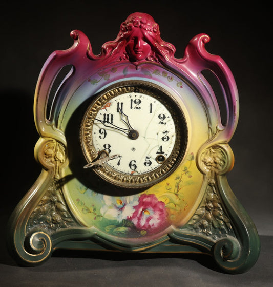 Antique Art Nouveau Porcelain Mantel Clock with Figural Head and Floral Decoration, Ansonia Clock Company, Bonn Germany, note severe damage to dial