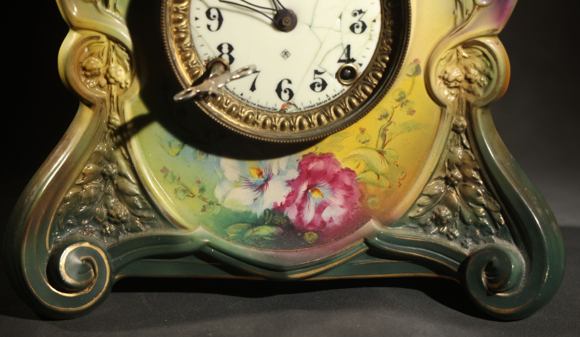 Antique Art Nouveau Porcelain Mantel Clock with Figural Head and Floral Decoration, Ansonia Clock Company, Bonn Germany, note severe damage to dial