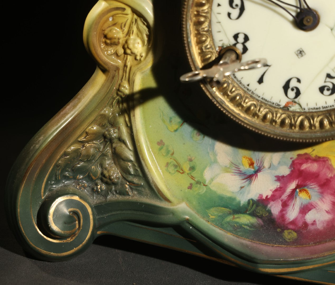 Antique Art Nouveau Porcelain Mantel Clock with Figural Head and Floral Decoration, Ansonia Clock Company, Bonn Germany, note severe damage to dial