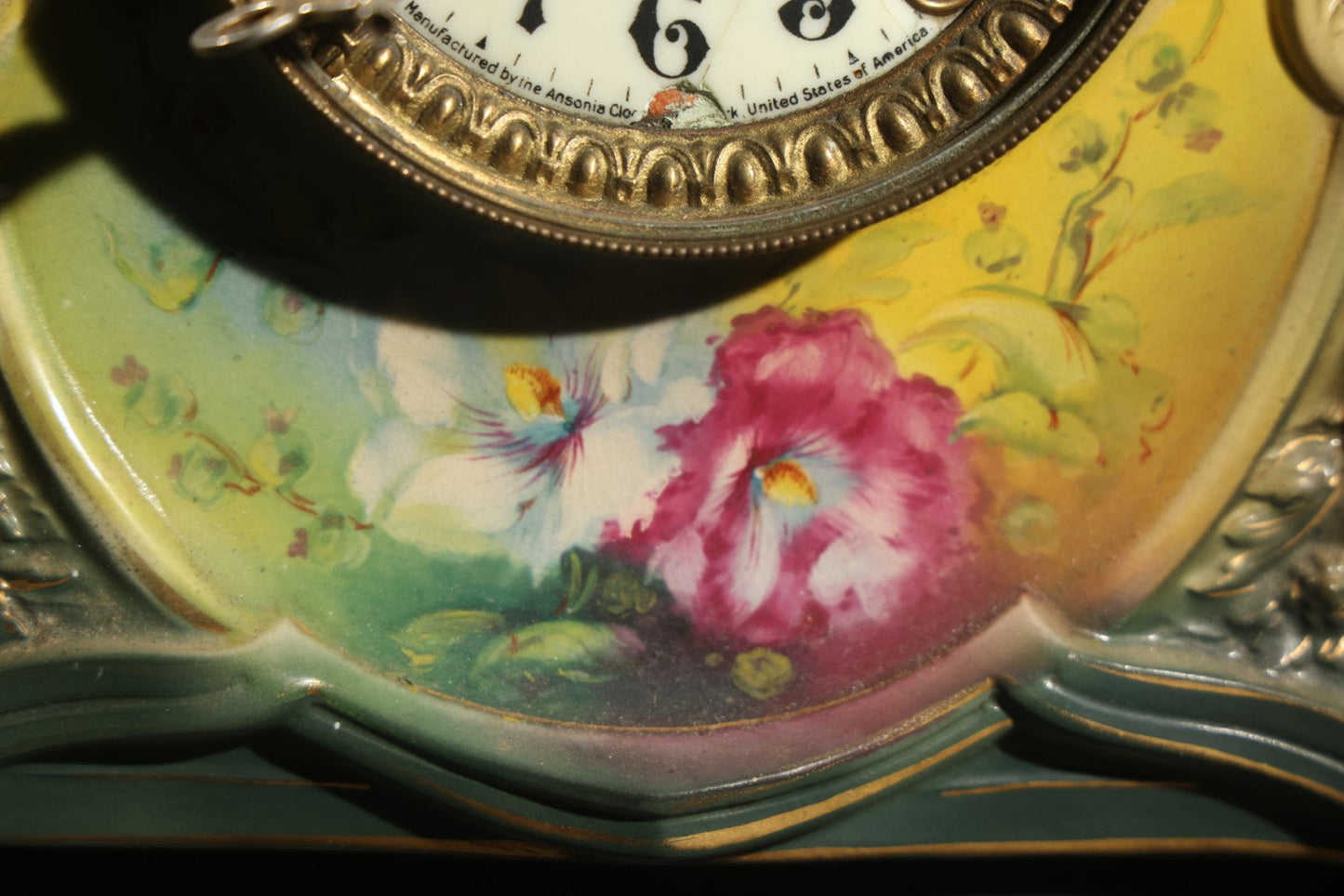 Antique Art Nouveau Porcelain Mantel Clock with Figural Head and Floral Decoration, Ansonia Clock Company, Bonn Germany, note severe damage to dial