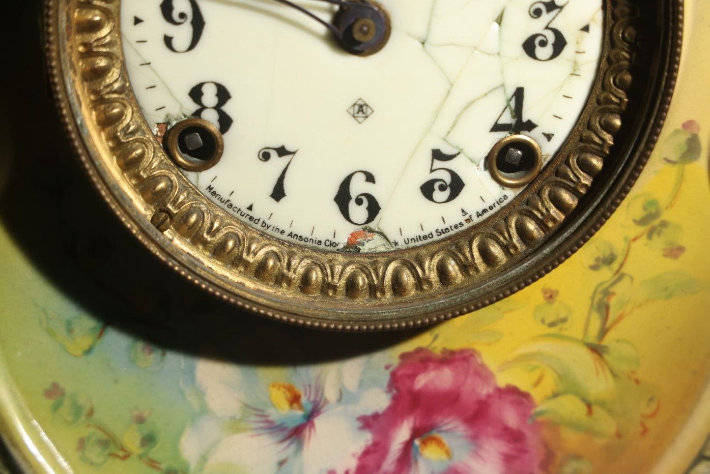 Antique Art Nouveau Porcelain Mantel Clock with Figural Head and Floral Decoration, Ansonia Clock Company, Bonn Germany, note severe damage to dial
