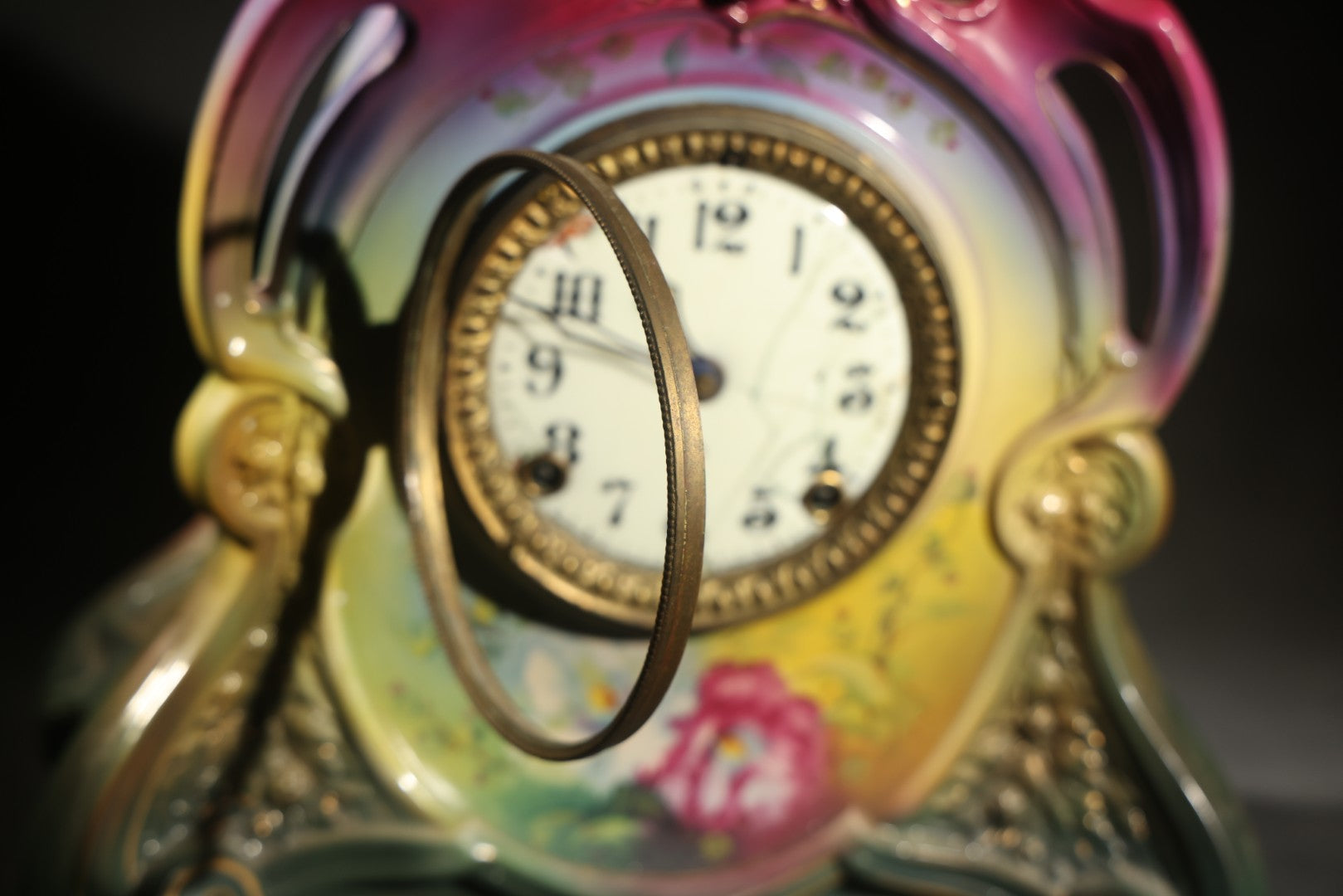 Antique Art Nouveau Porcelain Mantel Clock with Figural Head and Floral Decoration, Ansonia Clock Company, Bonn Germany, note severe damage to dial