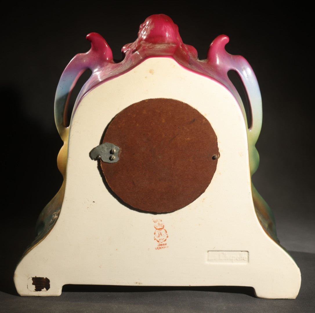 Antique Art Nouveau Porcelain Mantel Clock with Figural Head and Floral Decoration, Ansonia Clock Company, Bonn Germany, note severe damage to dial