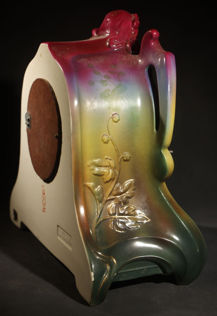 Antique Art Nouveau Porcelain Mantel Clock with Figural Head and Floral Decoration, Ansonia Clock Company, Bonn Germany, note severe damage to dial