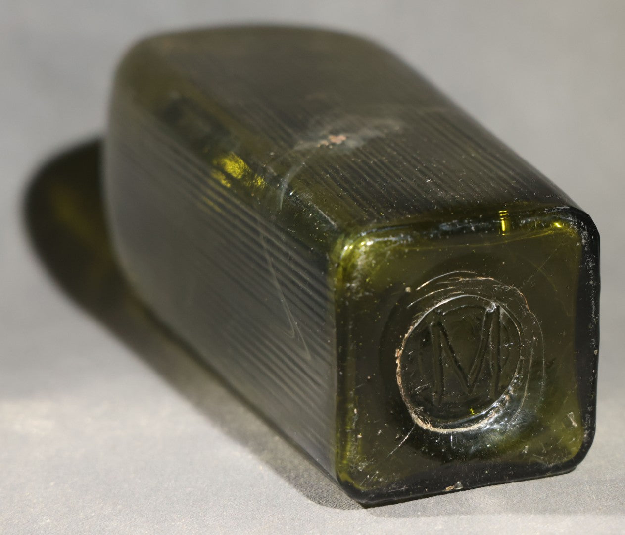 Grouping of Five Antique Case Bottles, Olive Green and Amber Glass, Tapered Square Form, Possible Gin Bottles, 19th Century & 20th century