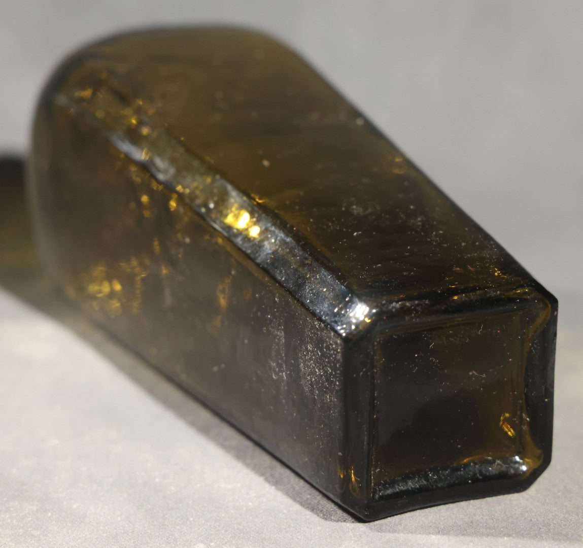 Grouping of Five Antique Case Bottles, Olive Green and Amber Glass, Tapered Square Form, Possible Gin Bottles, 19th Century & 20th century