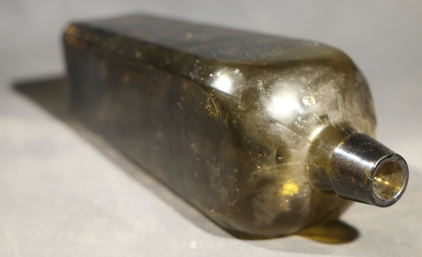 Grouping of Five Antique Case Bottles, Olive Green and Amber Glass, Tapered Square Form, Possible Gin Bottles, 19th Century & 20th century