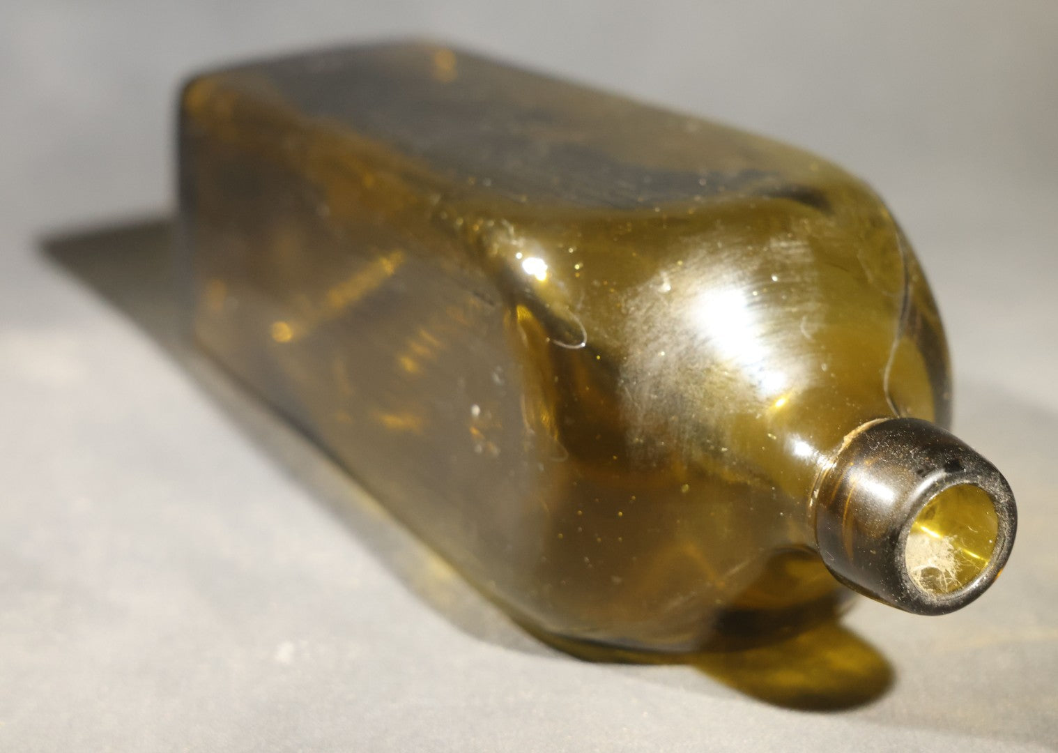 Grouping of Five Antique Case Bottles, Olive Green and Amber Glass, Tapered Square Form, Possible Gin Bottles, 19th Century & 20th century